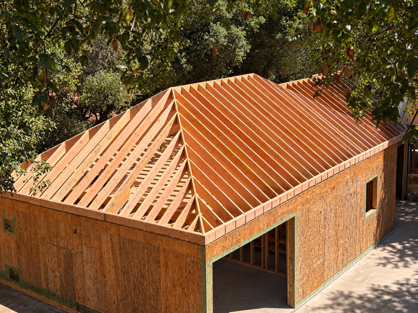Completed wood roof framing on a residential structure